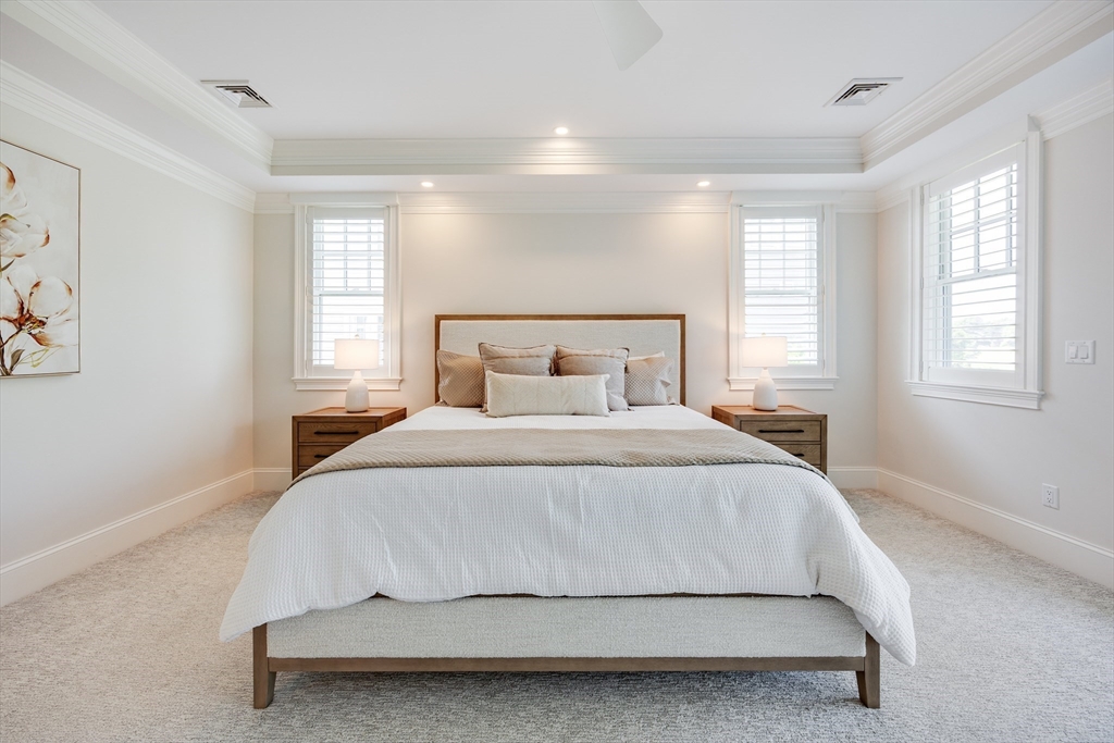 66 Simons Road, Unit C Mashpee, MA 02649 - Photo 19 of 42 a bedroom with a bed and window