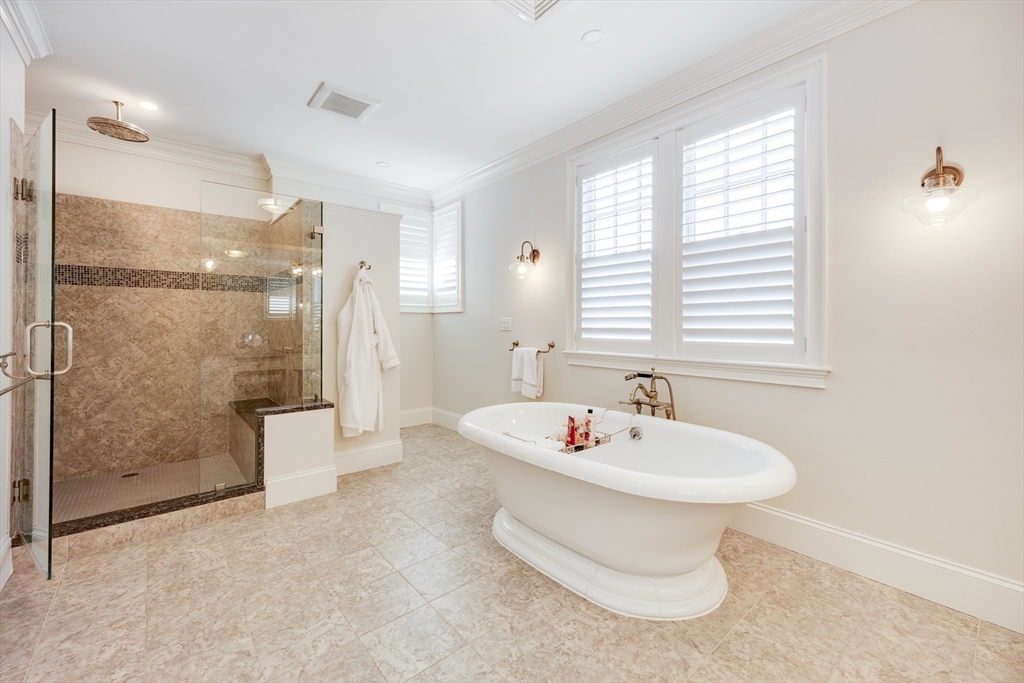 66 Simons Road, Unit C Mashpee, MA 02649 - Photo 21 of 42 a bathroom with a sink toilet and shower