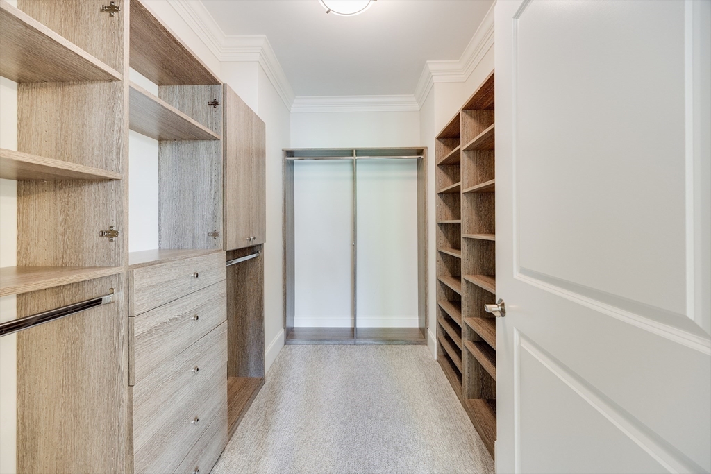 66 Simons Road, Unit C Mashpee, MA 02649 - Photo 23 of 42 a view of walk in closet with empty racks