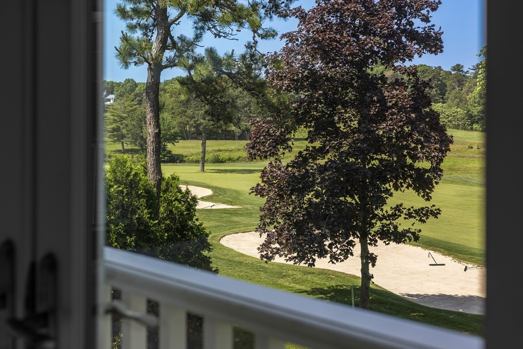 66 Simons Road, Unit C Mashpee, MA 02649 - Photo 28 of 42 a view of a yard from a window
