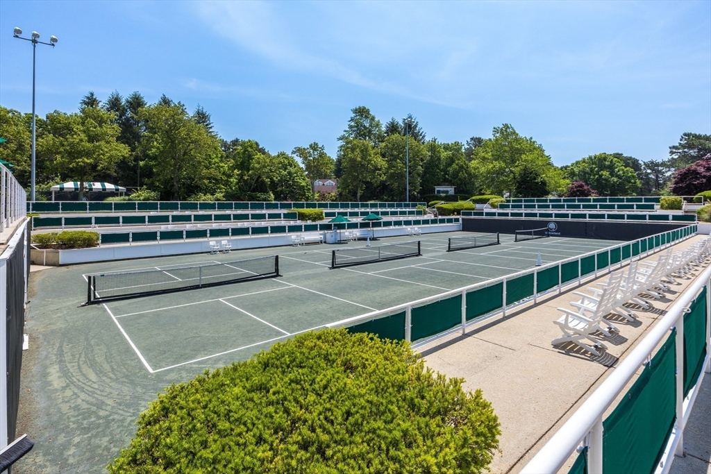 66 Simons Road, Unit C Mashpee, MA 02649 - Photo 35 of 42 a view from a balcony with two chairs