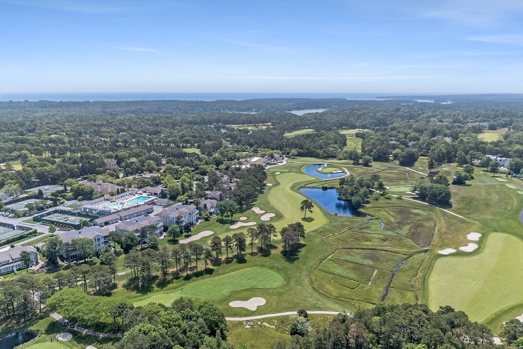 66 Simons Road, Unit C Mashpee, MA 02649 - Photo 39 of 42 an aerial view of residential houses with outdoor space