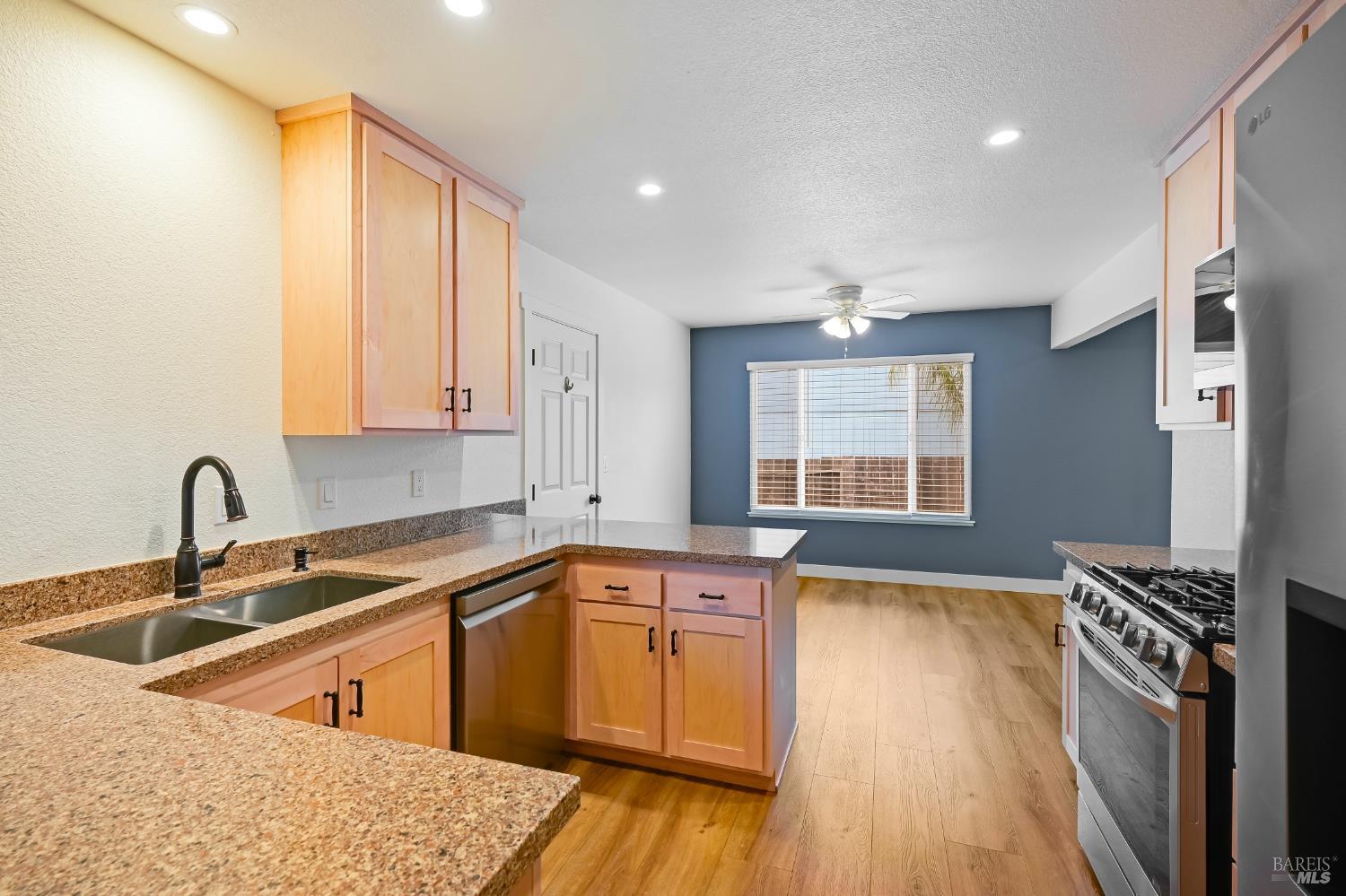 1536 Marlow Road Santa Rosa, CA 95401 - Photo 3 of 21 a kitchen with stainless steel appliances granite countertop a sink stove and cabinets