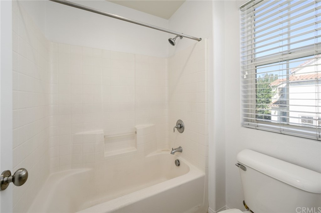 106 Tiger Lane Placentia, CA 92870 - Photo 18 of 35 a bathroom with a bathtub and a shower
