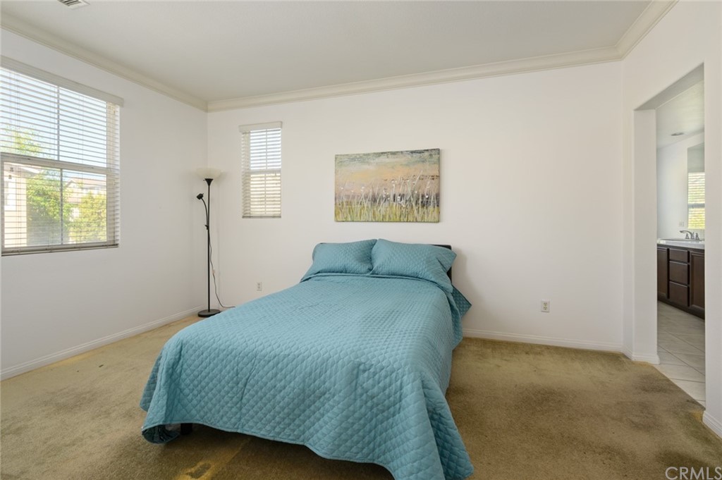 106 Tiger Lane Placentia, CA 92870 - Photo 24 of 35 a bed sitting in a bedroom next to a window