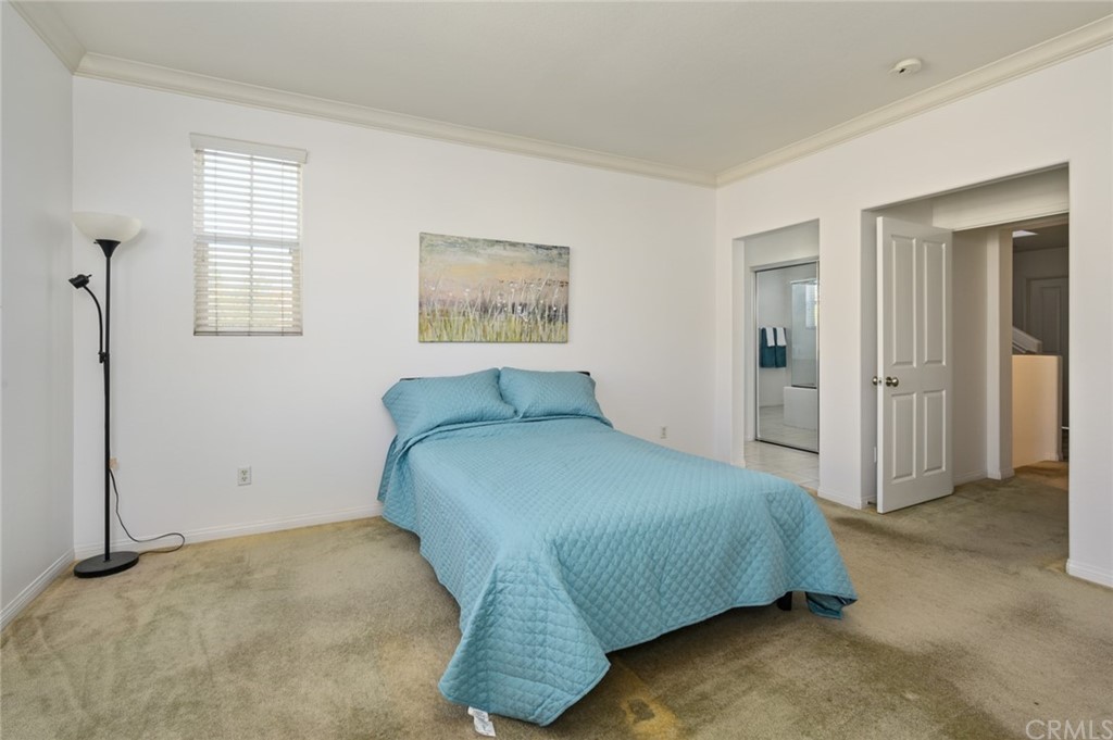 106 Tiger Lane Placentia, CA 92870 - Photo 25 of 35 a spacious bedroom with a bed and a cabinets