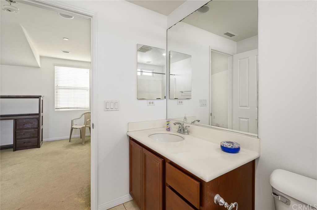 106 Tiger Lane Placentia, CA 92870 - Photo 35 of 35 a bathroom with a sink vanity and a mirror
