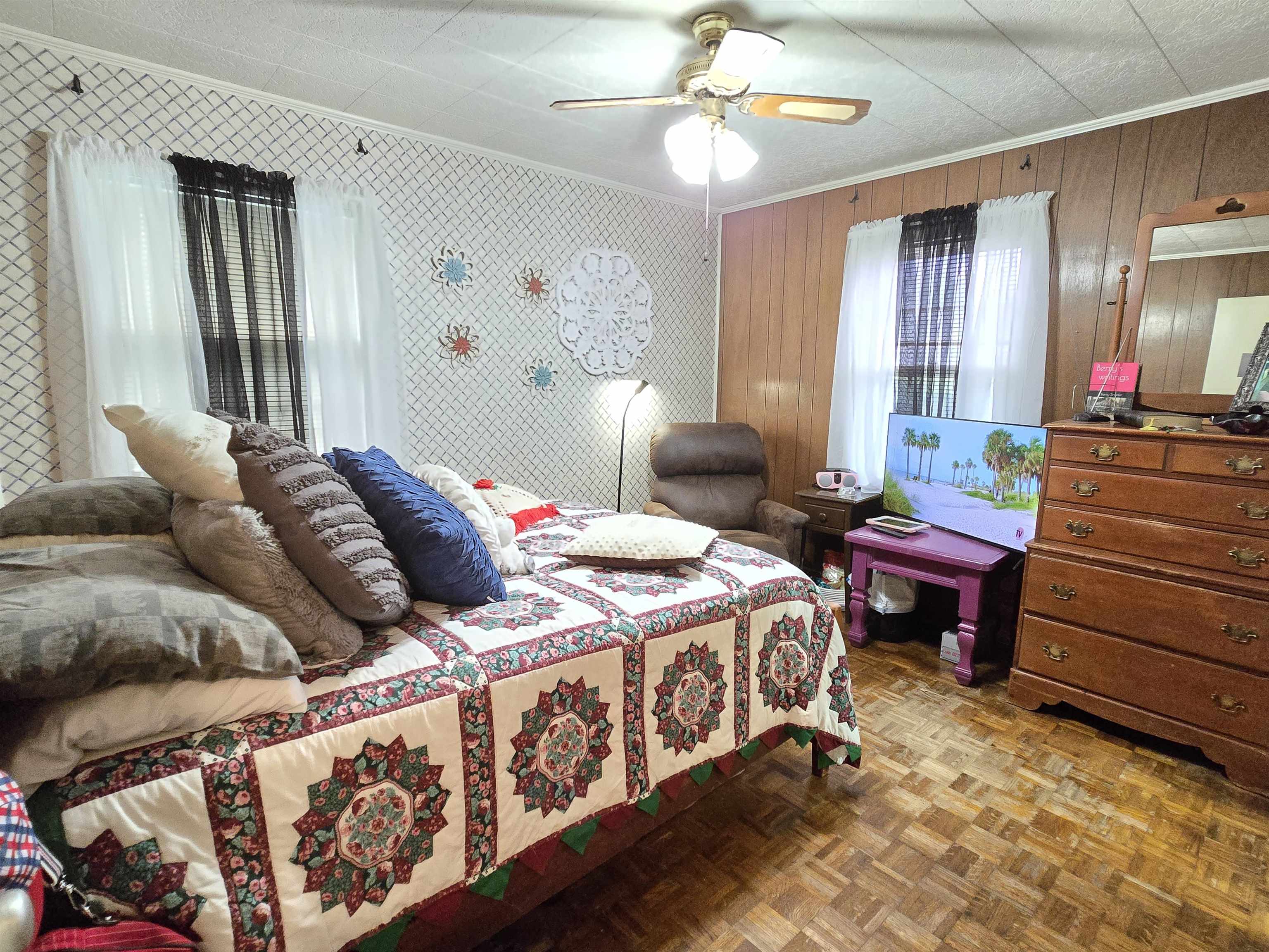 4885 Macon Road Memphis, TN 38122 - Photo 7 of 39 a bedroom with a bed and a chandelier