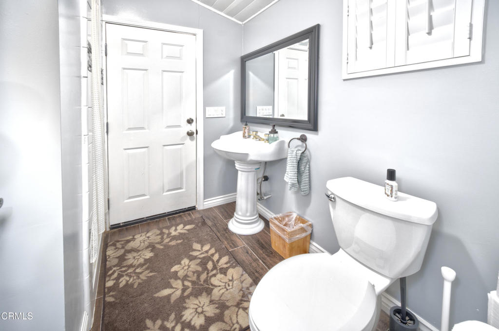 1112 Mockingbird Lane Fillmore, CA 93015 - Photo 11 of 21 a bathroom with a toilet sink and mirror