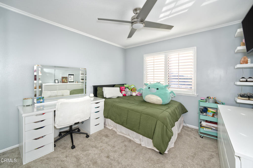 1112 Mockingbird Lane Fillmore, CA 93015 - Photo 14 of 21 a bedroom with a bed and a table