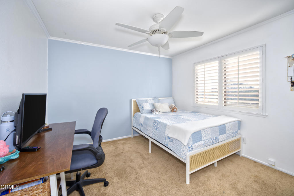 1112 Mockingbird Lane Fillmore, CA 93015 - Photo 15 of 21 a bedroom with a bed and a desk