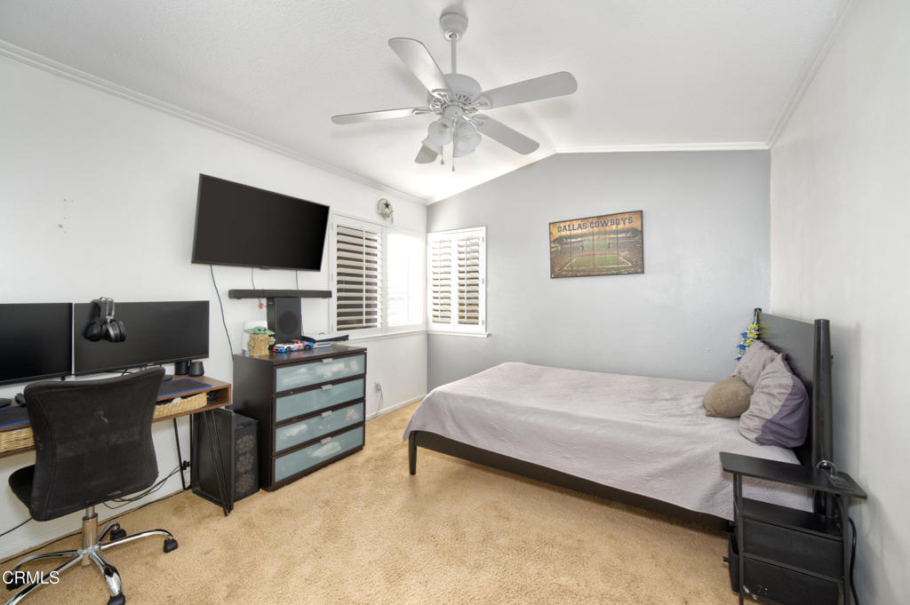 1112 Mockingbird Lane Fillmore, CA 93015 - Photo 16 of 21 a bedroom with a bed and a flat screen tv