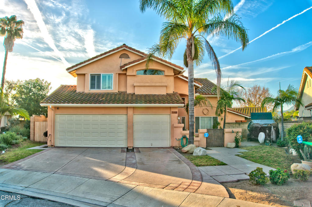 1112 Mockingbird Lane Fillmore, CA 93015 - Photo 2 of 21 a front view of a house with a yard and garage