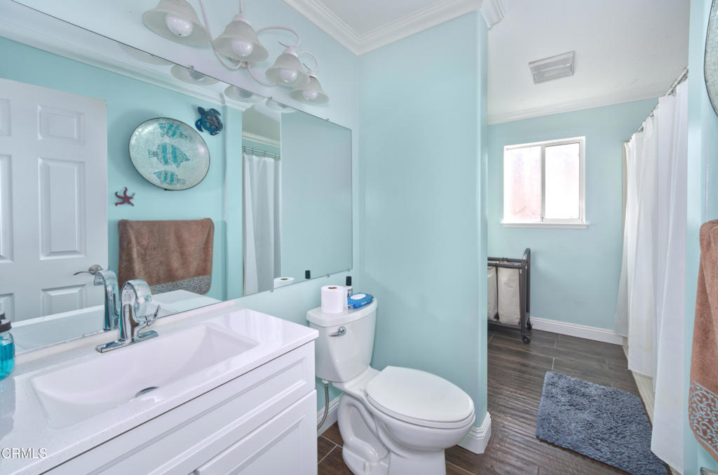 1112 Mockingbird Lane Fillmore, CA 93015 - Photo 9 of 21 a bathroom with a sink a toilet and a mirror