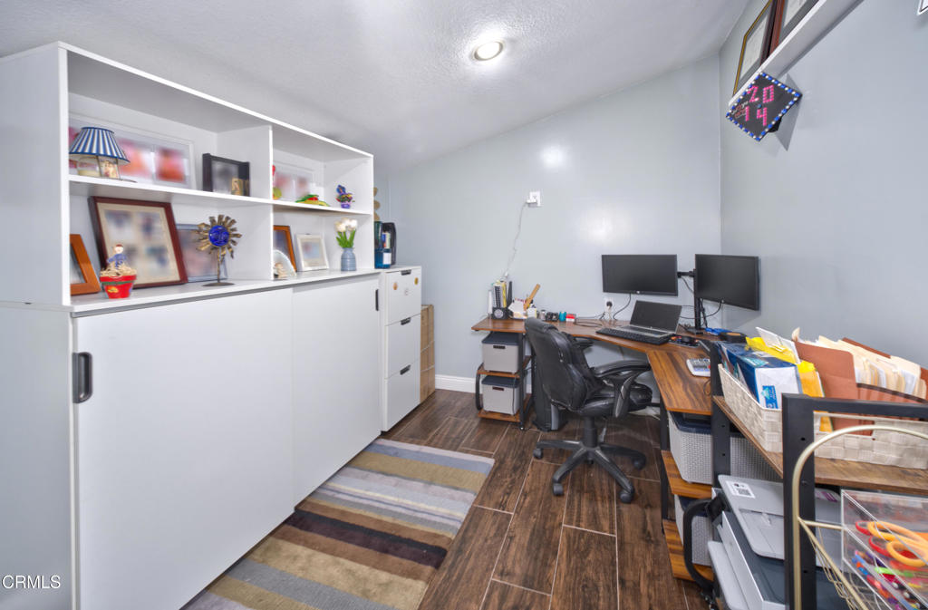 1112 Mockingbird Lane Fillmore, CA 93015 - Photo 10 of 21 a room with furniture and wooden floor