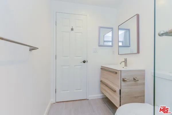 a bathroom with a sink toilet and vanity