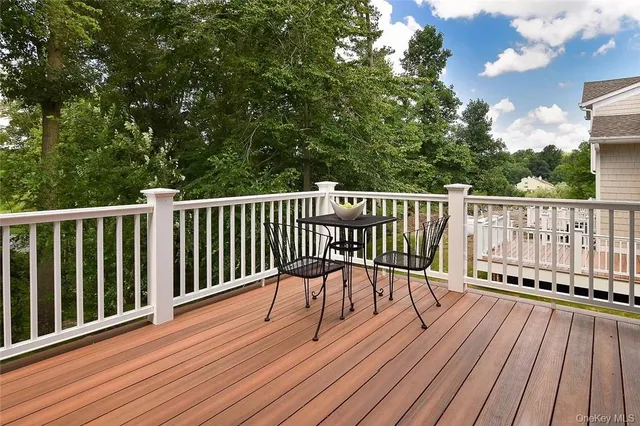 a view of deck with wooden floor and fence