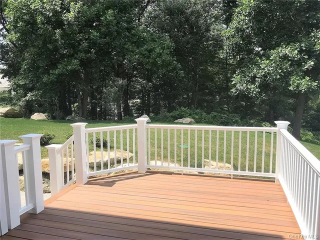 a view of a deck with a wooden fence