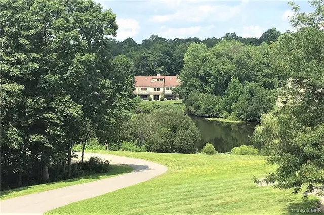 a view of a garden with a lake view