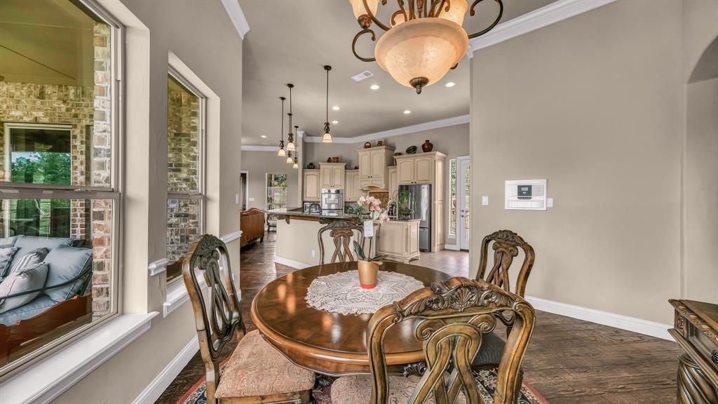 840 Hensley Road Gordon, TX 76453 - Photo 20 of 40 Dining space with crown molding, recessed lighting, baseboards, and visible vents