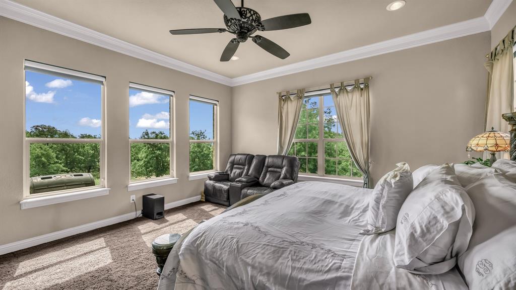 840 Hensley Road Gordon, TX 76453 - Photo 22 of 40 Bedroom with baseboards, recessed lighting, crown molding, and ceiling fan