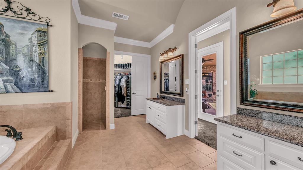 840 Hensley Road Gordon, TX 76453 - Photo 26 of 40 Full bathroom featuring visible vents, ornamental molding, tile patterned floors, and vanity