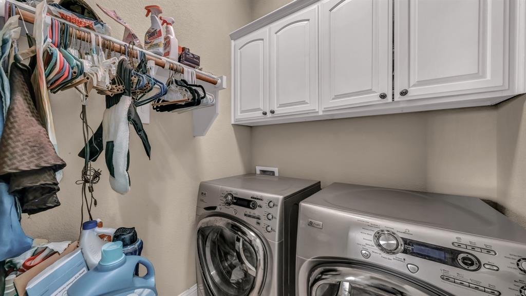 840 Hensley Road Gordon, TX 76453 - Photo 28 of 40 Laundry room featuring separate washer and dryer and cabinet space