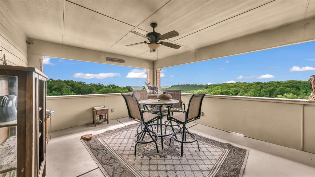 840 Hensley Road Gordon, TX 76453 - Photo 33 of 40 Balcony with ceiling fan