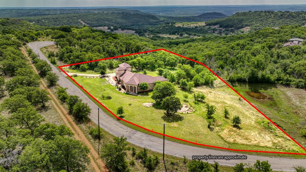 840 Hensley Road Gordon, TX 76453 - Photo 40 of 40 Birds eye view of property featuring a wooded view