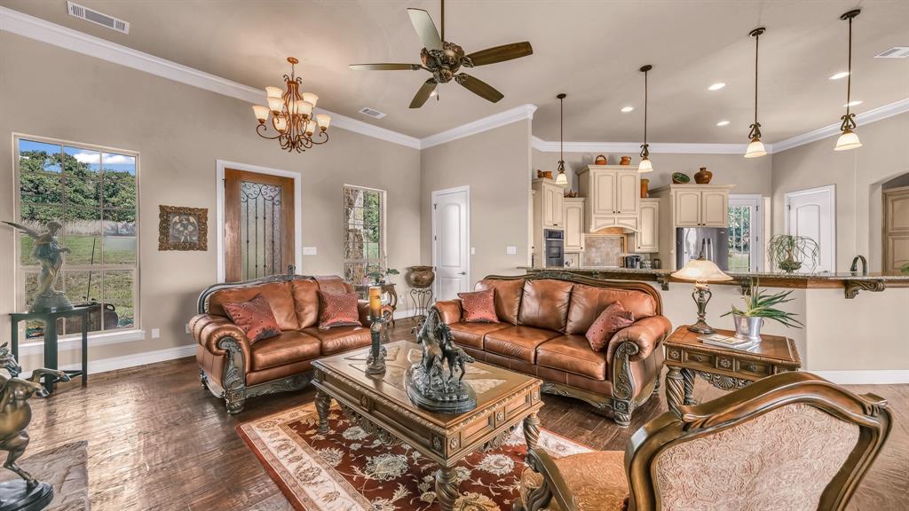 840 Hensley Road Gordon, TX 76453 - Photo 7 of 40 Living area with baseboards, visible vents, and plenty of natural light