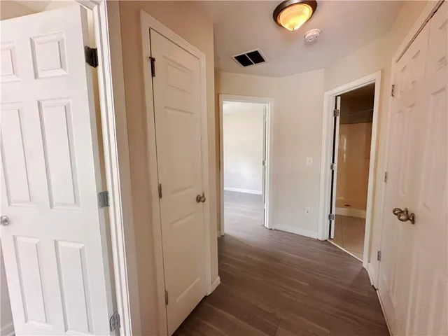 a view of a livingroom with wooden floor
