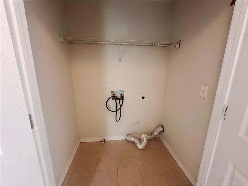 838 Store House Court, Unit A Monroe, GA 30655 - Photo 21 of 22 a view of a room with rack on the wall