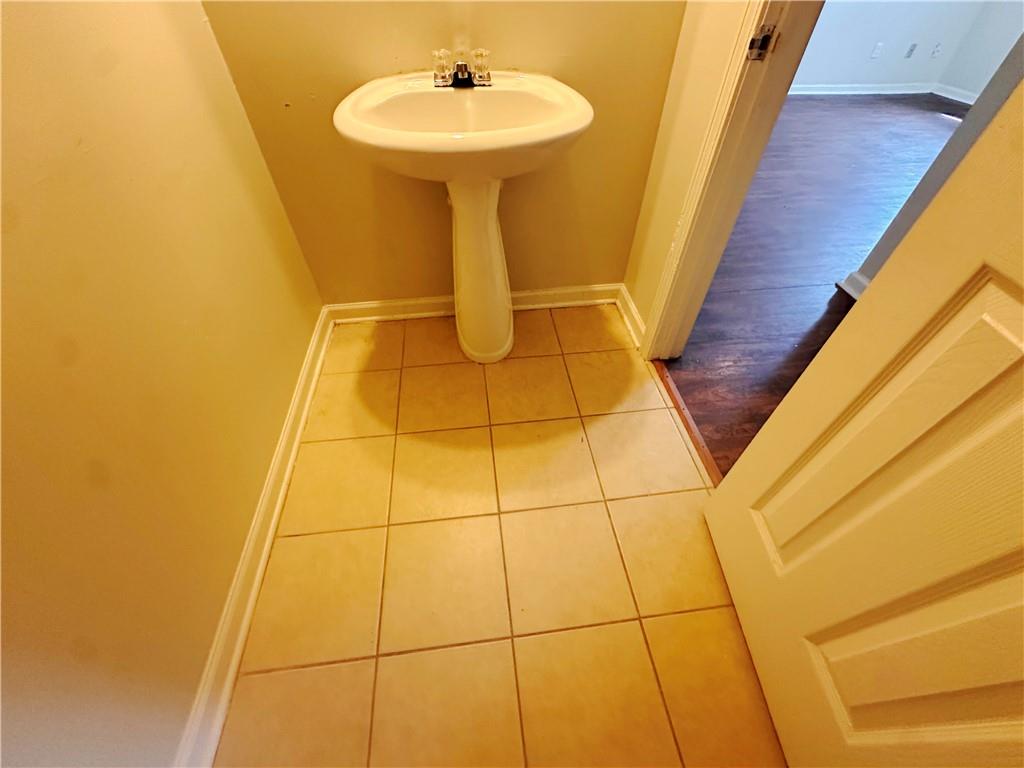 838 Store House Court, Unit A Monroe, GA 30655 - Photo 8 of 22 a bathroom with a sink