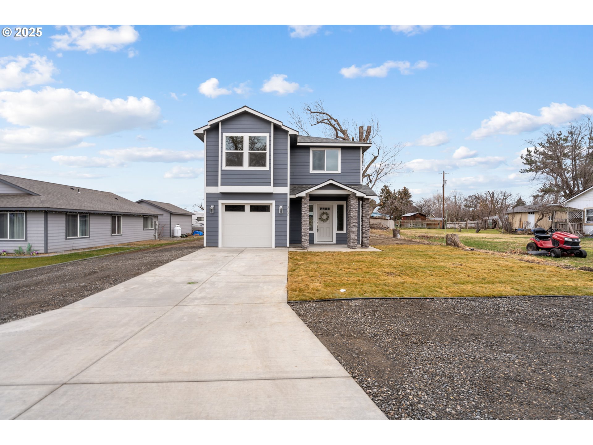 360 Southeast 4th Street Irrigon, OR 97844 - Photo 2 of 36 a view of multiple houses with a yard