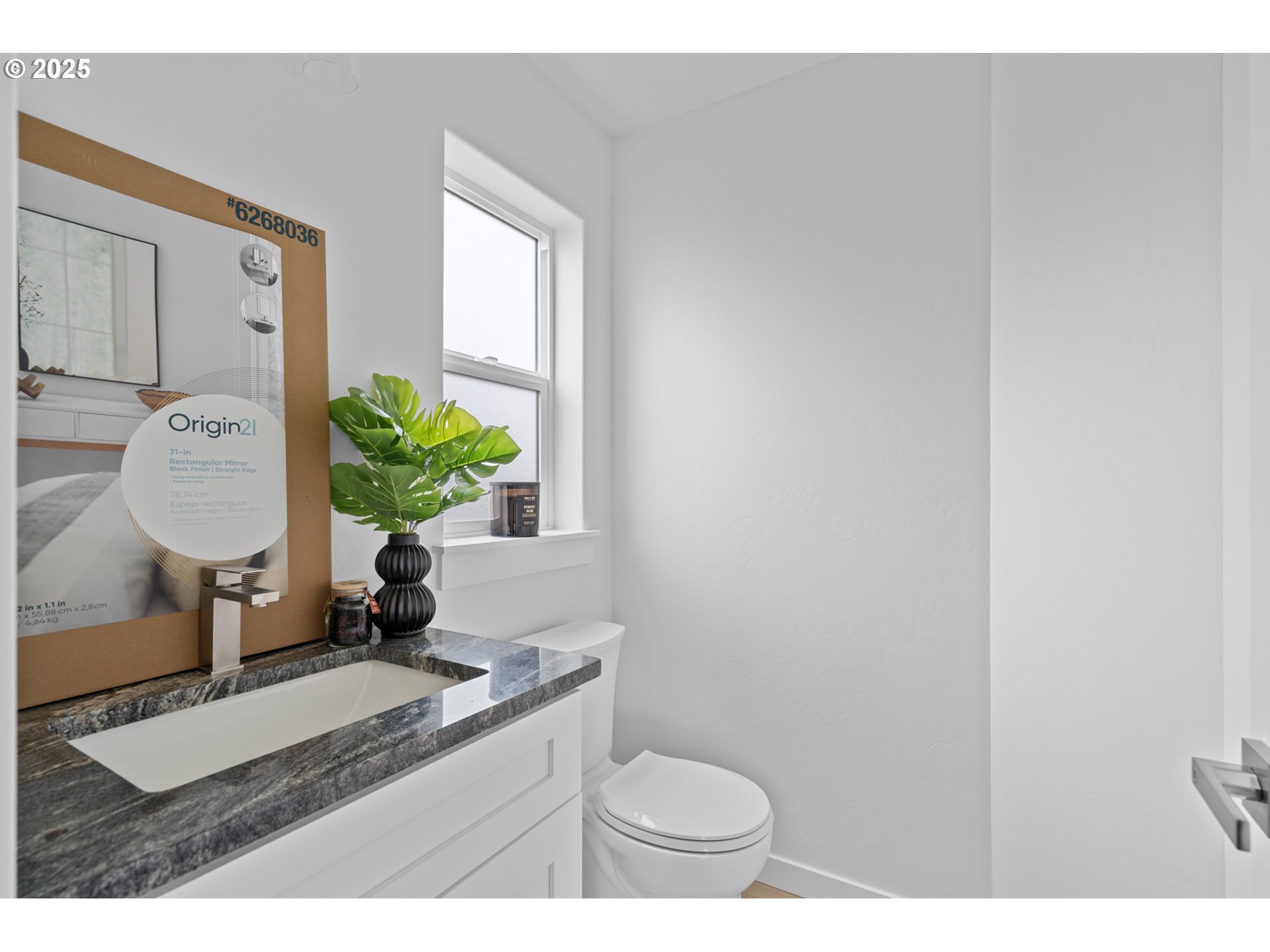 360 Southeast 4th Street Irrigon, OR 97844 - Photo 28 of 36 a bathroom with a toilet a sink and a mirror