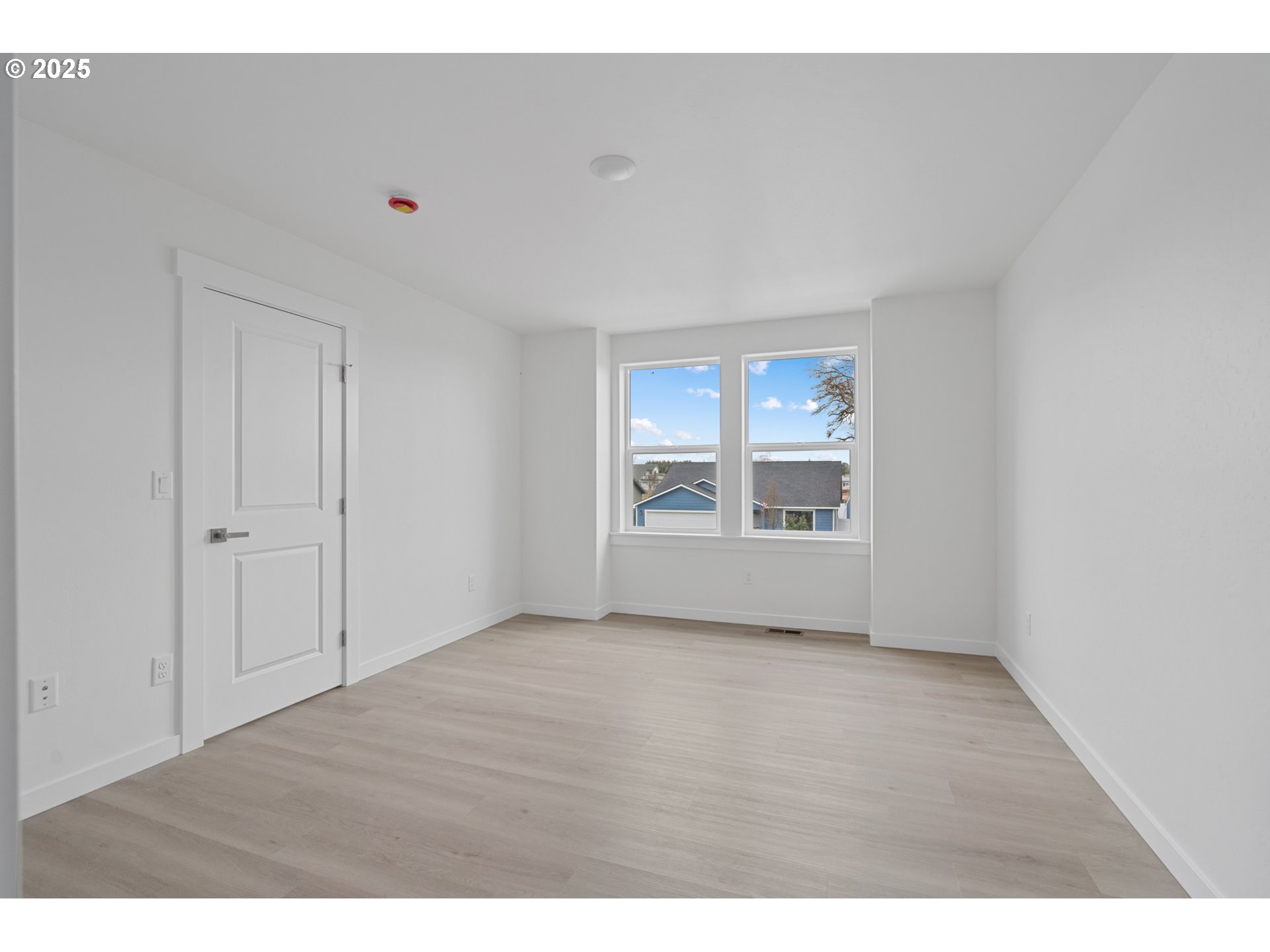 360 Southeast 4th Street Irrigon, OR 97844 - Photo 31 of 36 a view of an empty room with a window and wooden floor