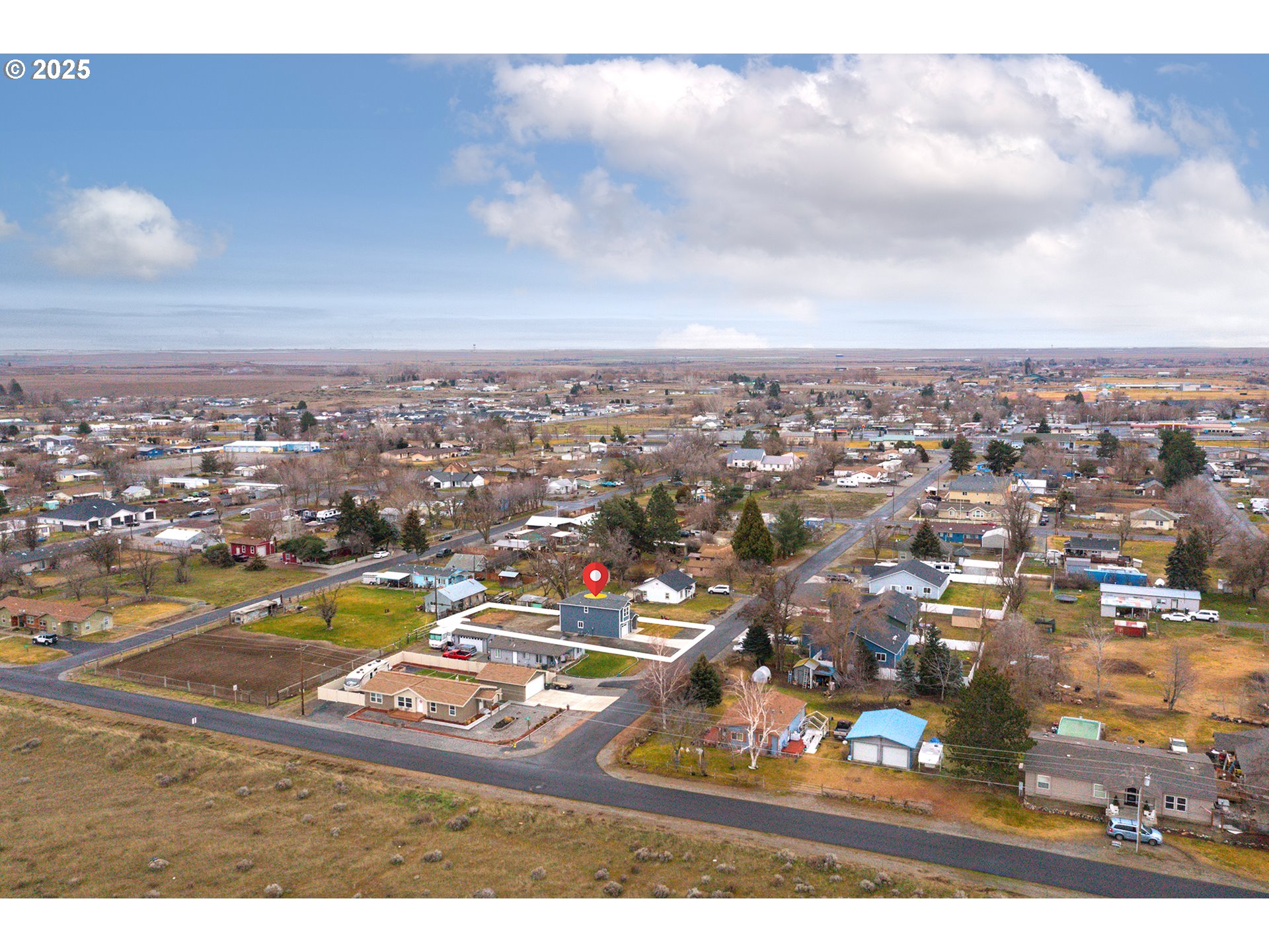 360 Southeast 4th Street Irrigon, OR 97844 - Photo 7 of 36 an aerial view of residential houses with outdoor space