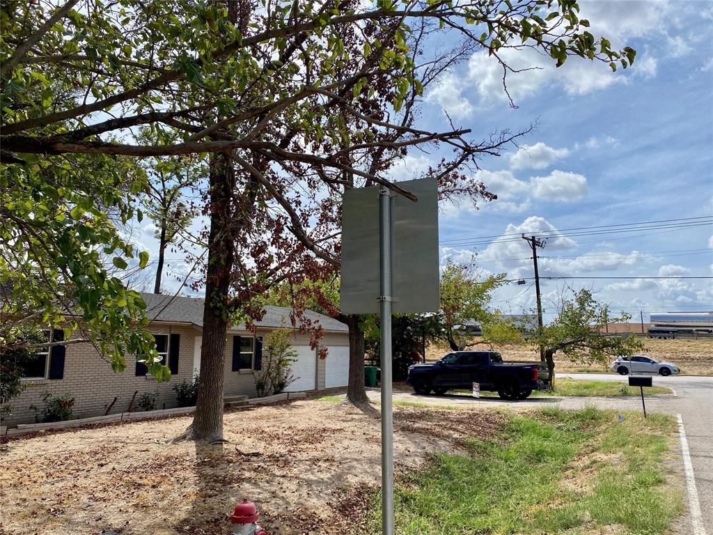 100 Burl Street Corinth, TX 76208 - Photo 14 of 16 a view of a house with a tree in the yard
