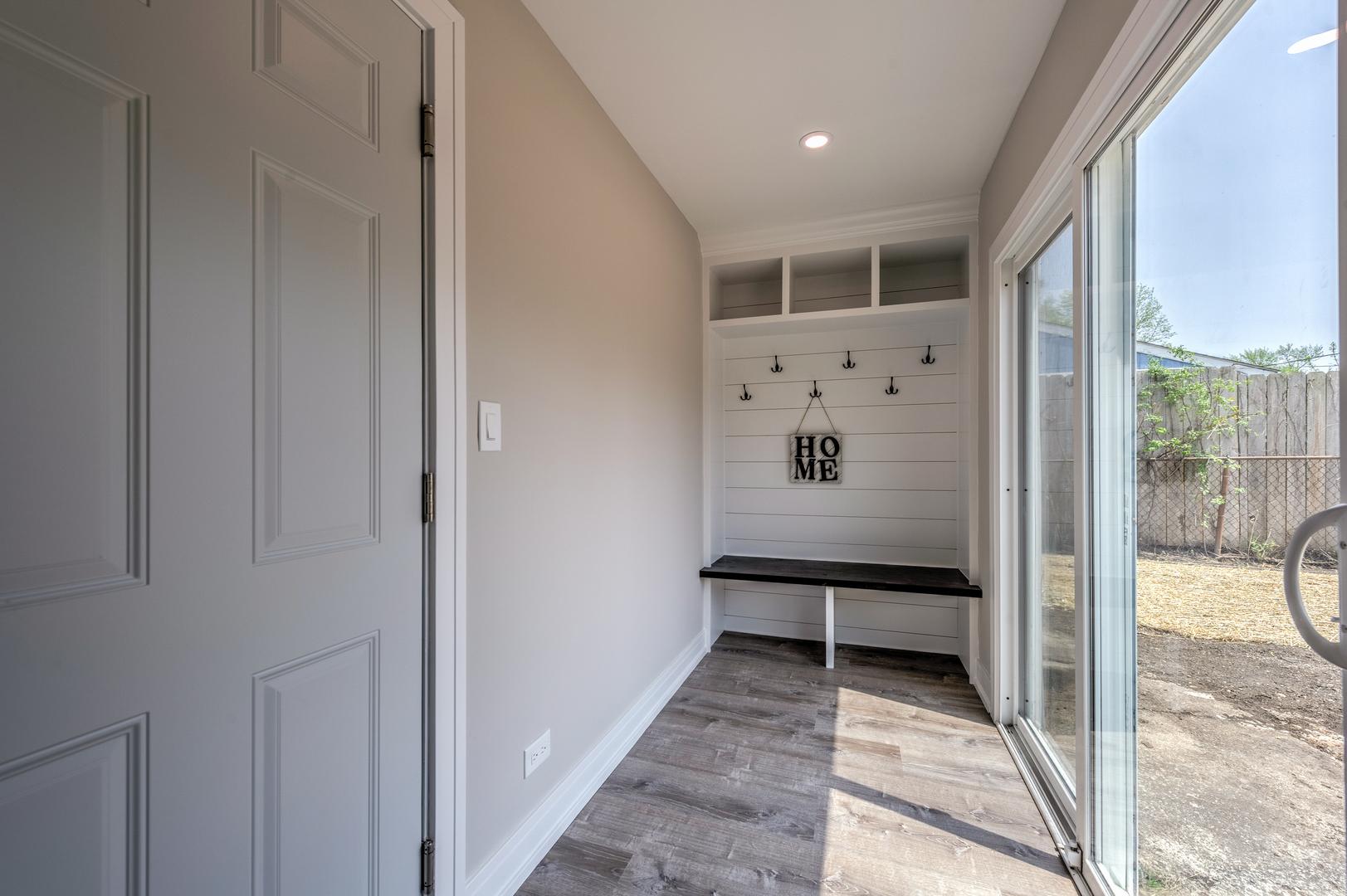 178 Queenswood Road Bolingbrook, IL 60440 - Photo 12 of 26 a view of a hallway with wooden floor and windows