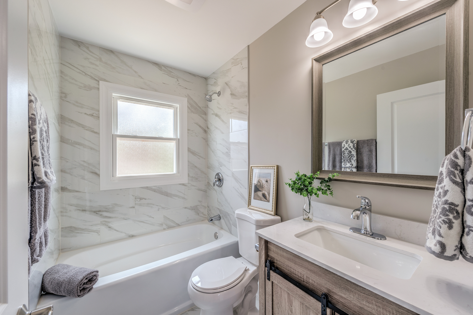 178 Queenswood Road Bolingbrook, IL 60440 - Photo 21 of 26 a bathroom with a granite countertop sink a toilet and shower