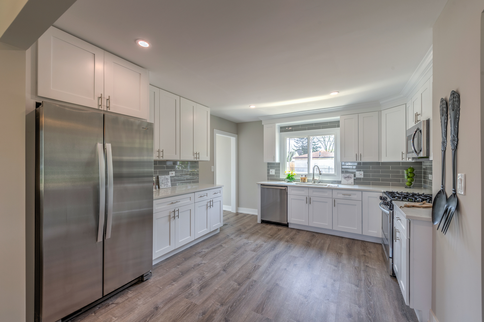 178 Queenswood Road Bolingbrook, IL 60440 - Photo 8 of 26 a kitchen with a refrigerator and a sink