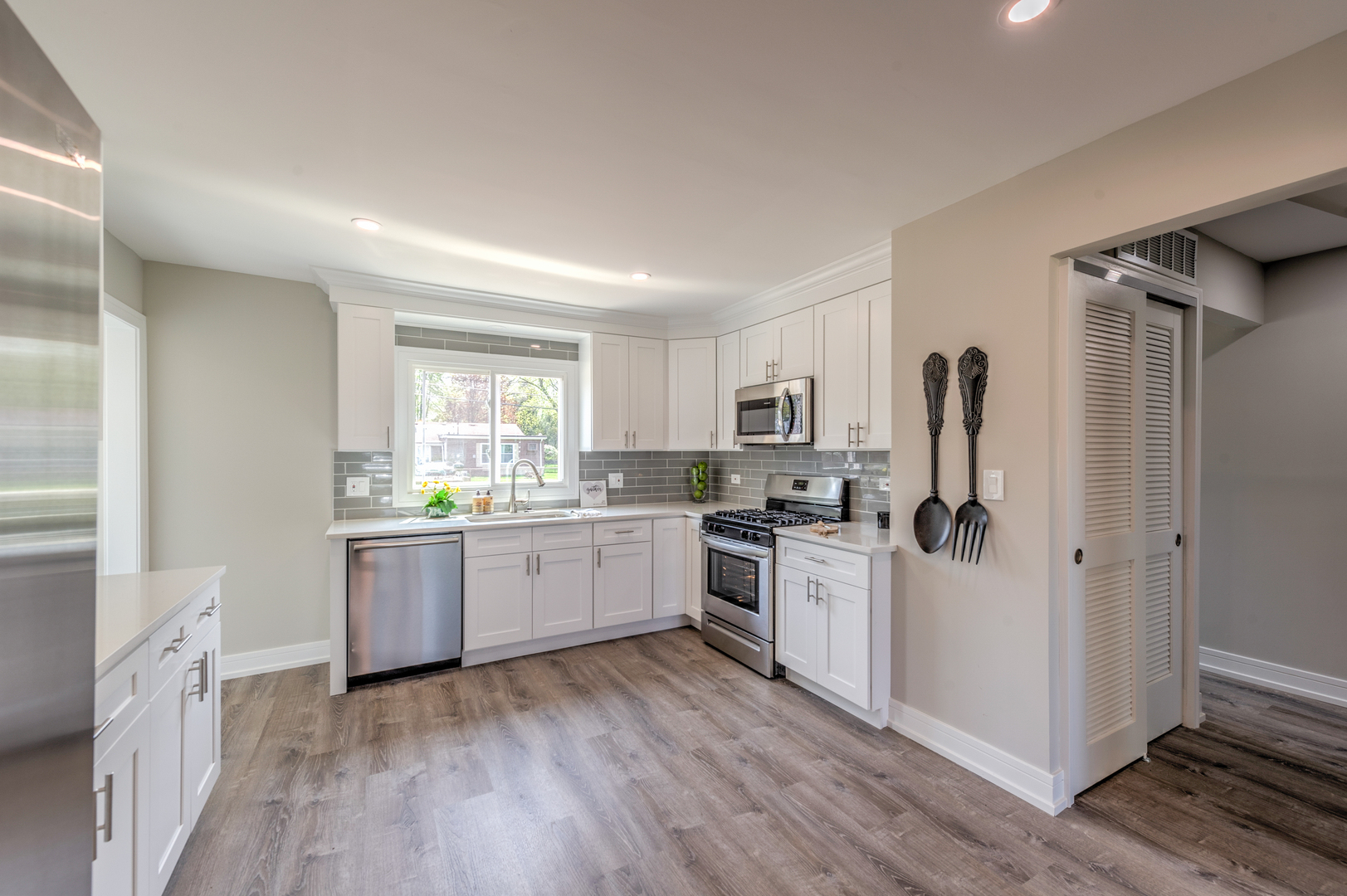 178 Queenswood Road Bolingbrook, IL 60440 - Photo 9 of 26 a kitchen with white cabinets and white appliances