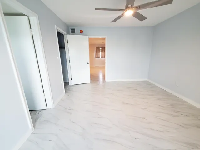 a view of a kitchen with a sink and a window
