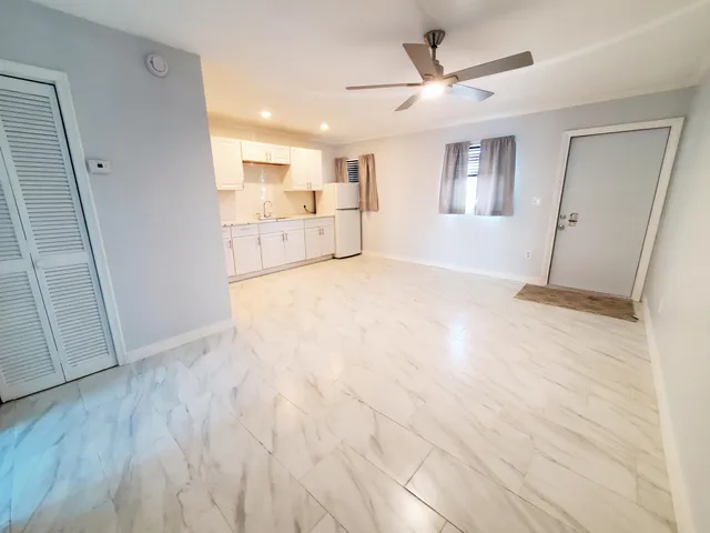 a view of a kitchen with a sink and cabinet area