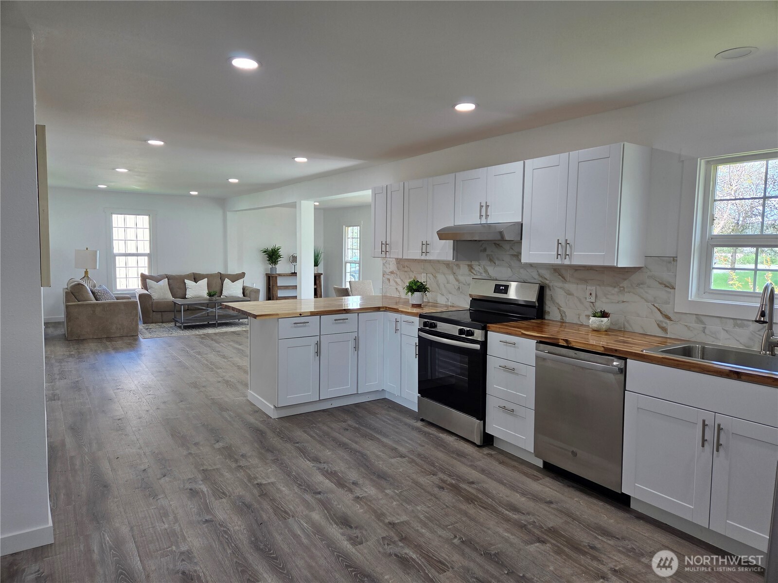 175 Stevens Road Chehalis, WA 98532 - Photo 8 of 32 a large kitchen with stainless steel appliances granite countertop a stove a sink a refrigerator and white cabinets