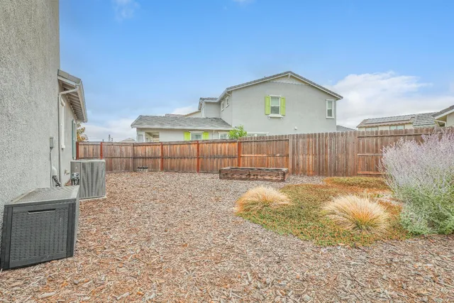 a view of staircase with white walls and a window