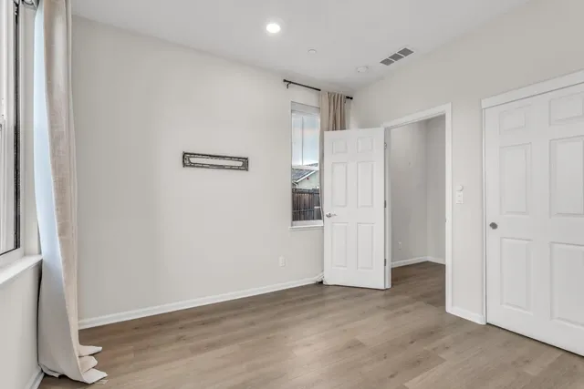 a bathroom with a shower sink vanity mirror and toilet