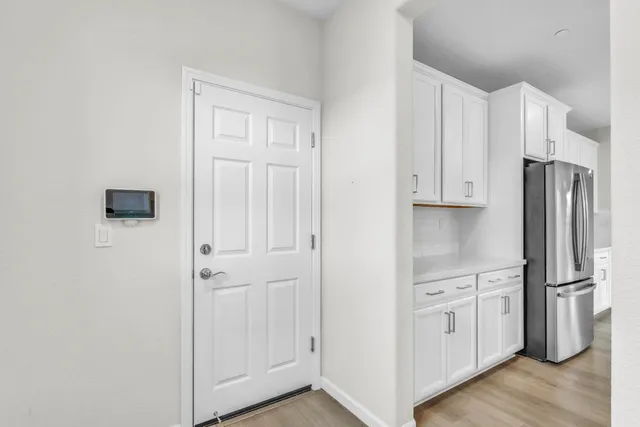 an empty room with closet and a bathroom