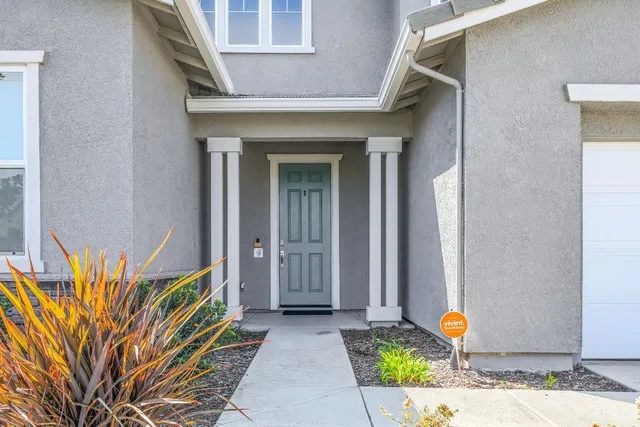 a front view of a house with a outdoor space