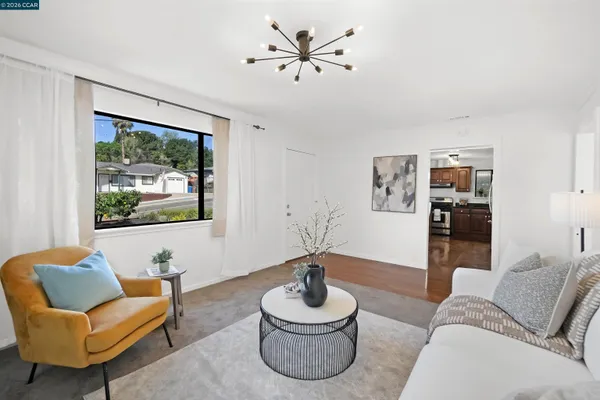 a bedroom with a bed and a chair